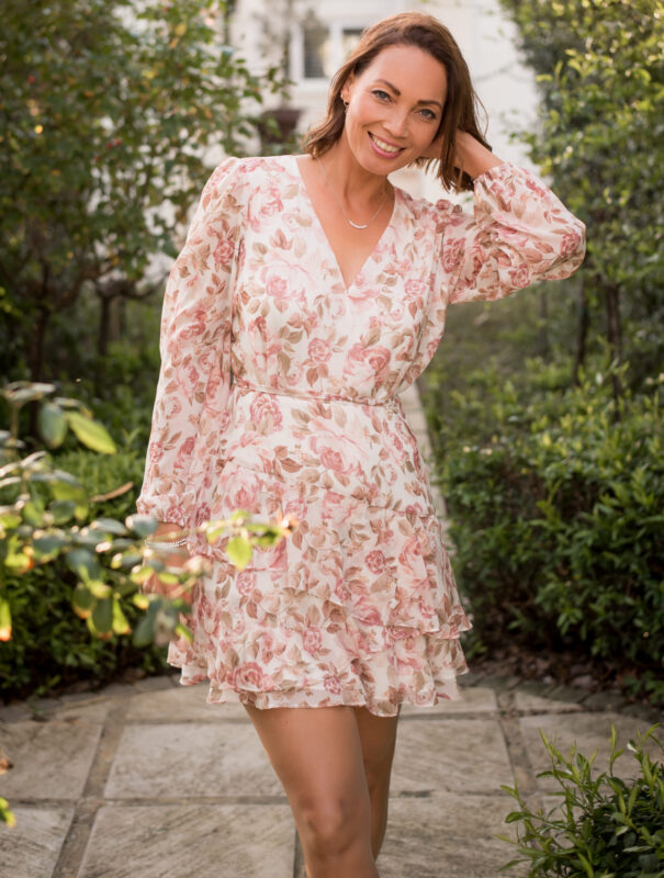 Tuané Kirschner in summer dress posing for photo with beautiful smile